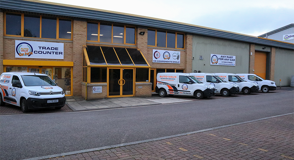 Autovaux Car Parts Dewsbury Store Front, with a fleet of delivery vans parked outside.